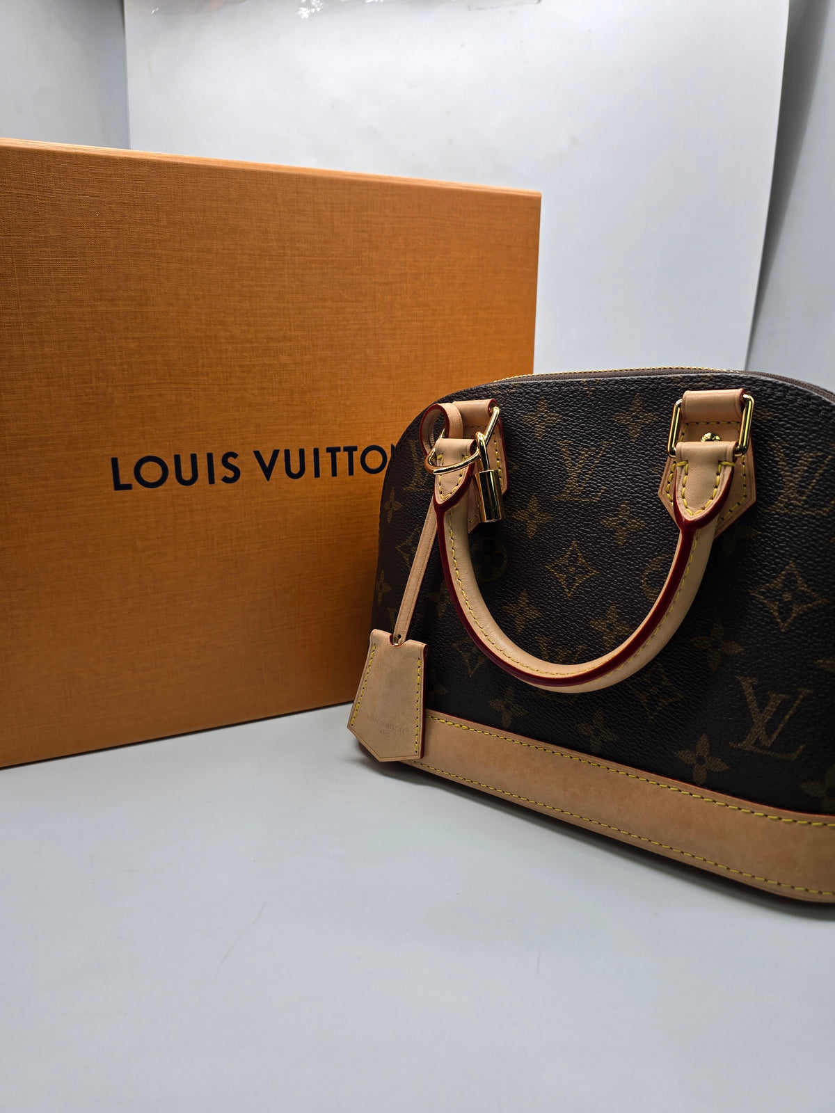 Louis Vuitton Alma BB Bag canvas with natural vachetta leather trim and gold-tone hardware, Grade B