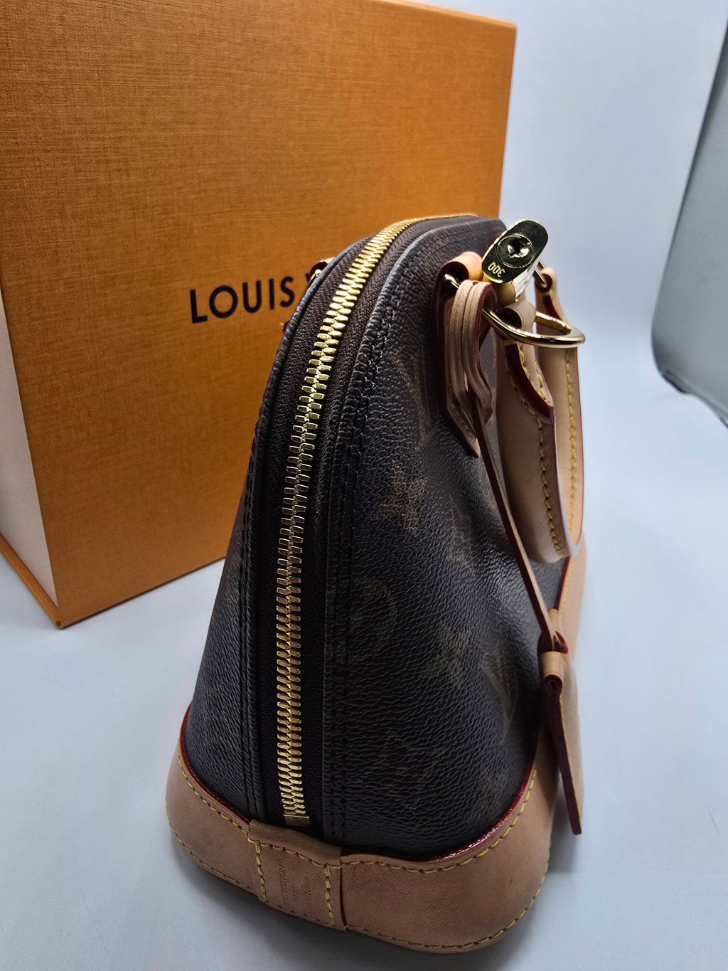 Louis Vuitton Alma BB Bag canvas with natural vachetta leather trim and gold-tone hardware, Grade B