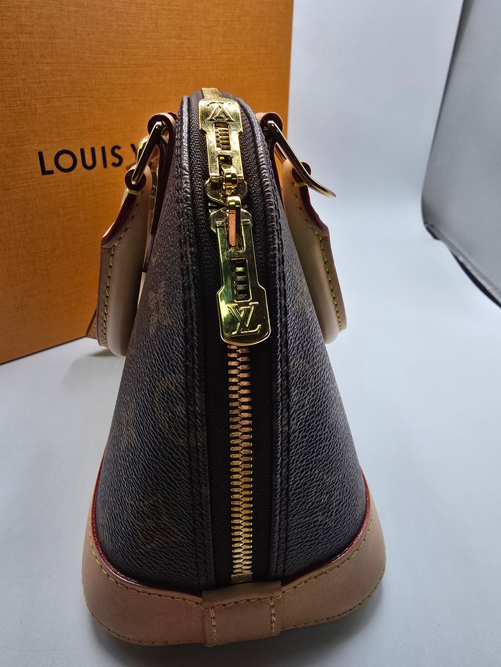 Louis Vuitton Alma BB Bag canvas with natural vachetta leather trim and gold-tone hardware, Grade B