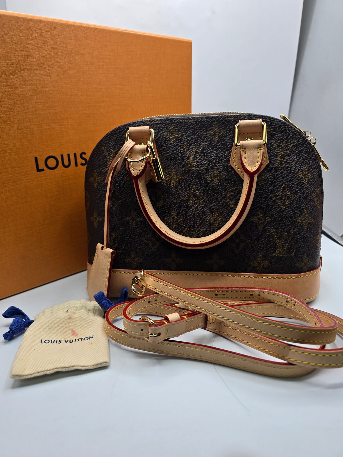 Louis Vuitton Alma BB Bag canvas with natural vachetta leather trim and gold-tone hardware, Grade B