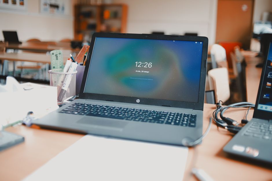 Laptops — stock photo by Adam Sondel via Pexels (https://www.pexels.com/photo/laptops-in-a-classroom-20432893/)