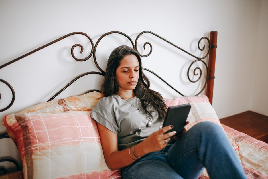 Tablets — stock photo by Helena Lopes via Pexels (https://www.pexels.com/photo/brunette-woman-sitting-with-tablet-on-bed-27177611/)