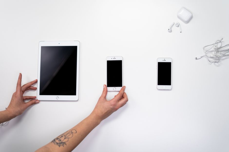 iPhones — stock photo by cottonbro studio via Pexels (https://www.pexels.com/photo/person-holding-white-ipad-beside-white-iphone-5-3945689/)