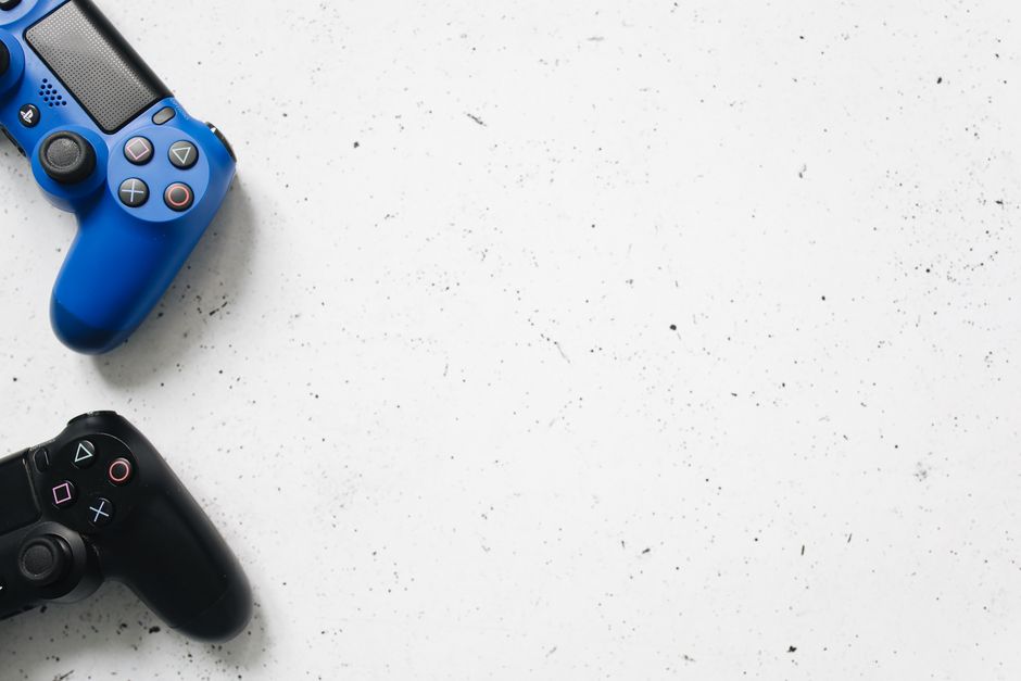 Games Consoles — stock photo by Polina Tankilevitch via Pexels (https://www.pexels.com/photo/blue-and-black-game-controllers-on-a-white-surface-4523006/)