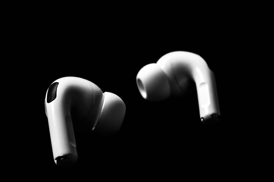 AirPods — stock photo by kavin pradeep via Pexels (https://www.pexels.com/photo/wireless-earpods-on-black-background-9204671/)