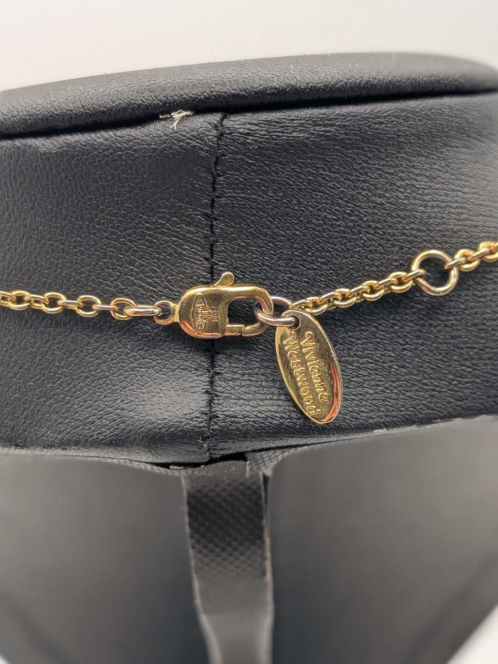 Vivienne Westwood Gold-tone Pendant necklace with a Pink Crystal Embellished Saturn Orb charm, Grade B