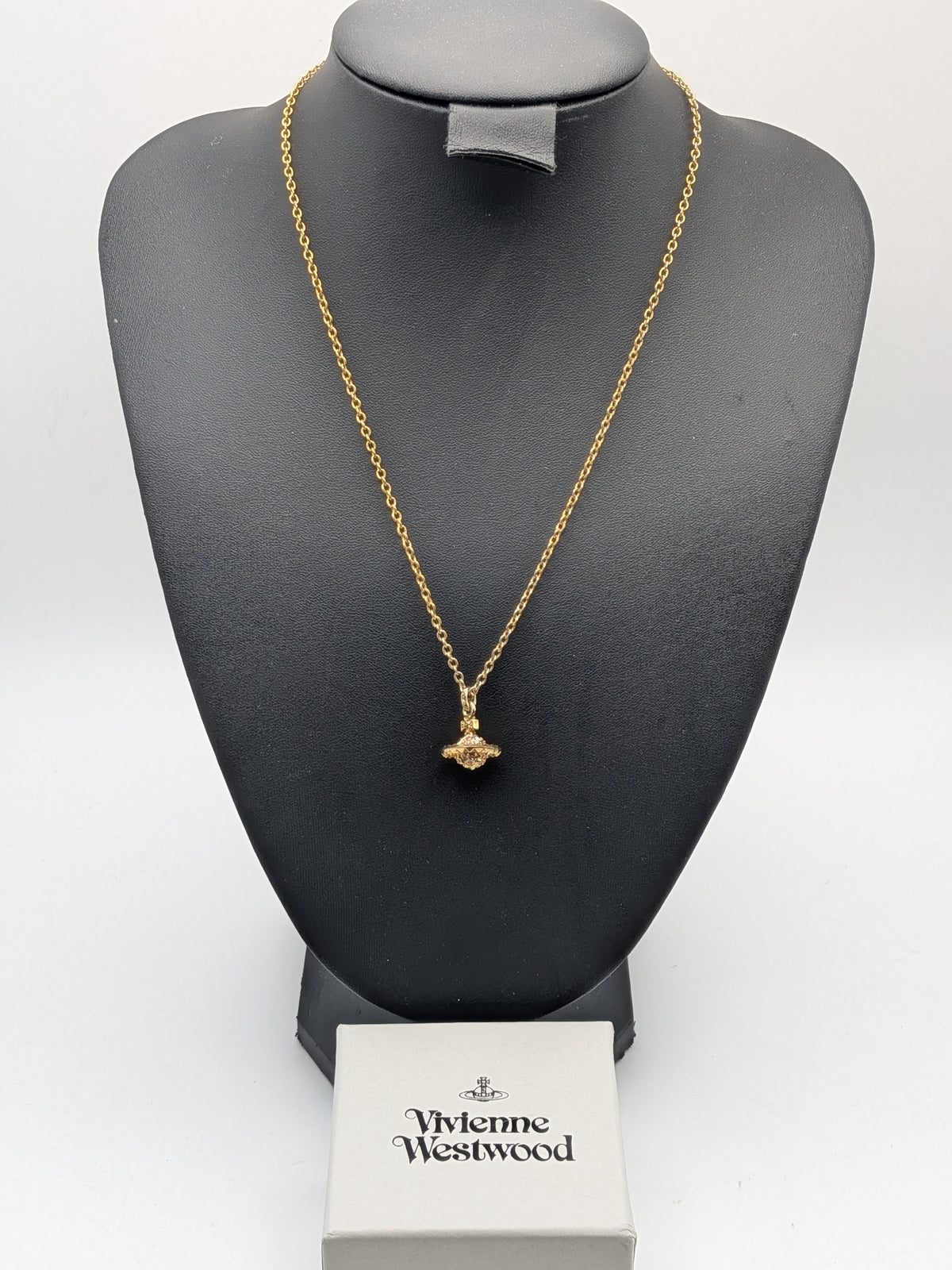 Vivienne Westwood Gold-tone Pendant necklace with a Pink Crystal Embellished Saturn Orb charm, Grade B