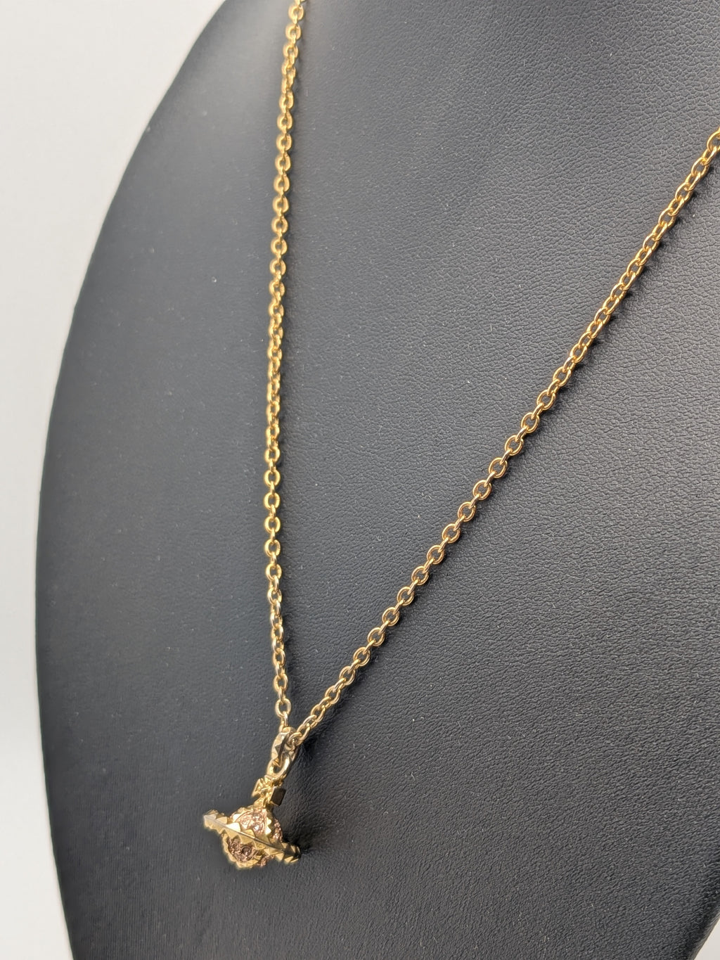 Vivienne Westwood Gold-tone Pendant necklace with a Pink Crystal Embellished Saturn Orb charm, Grade B